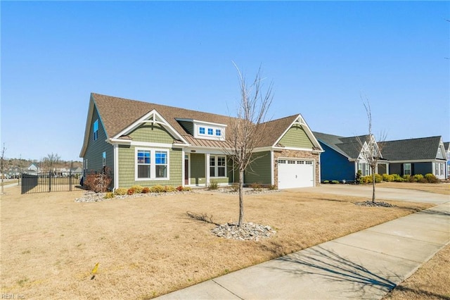 craftsman inspired home with a gate, concrete driveway, an attached garage, and fence