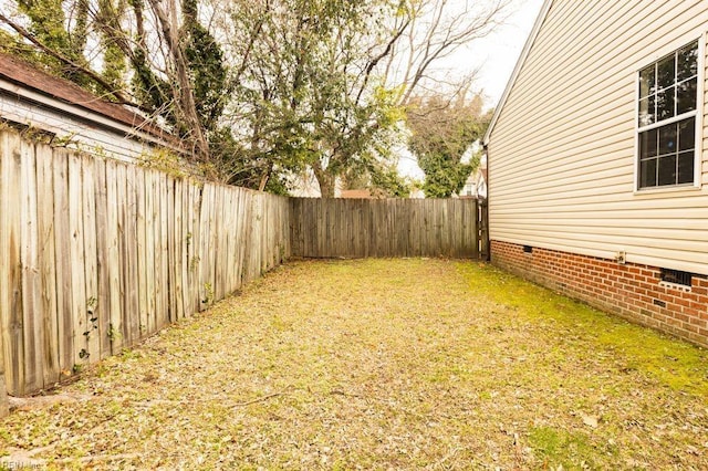 view of yard with a fenced backyard