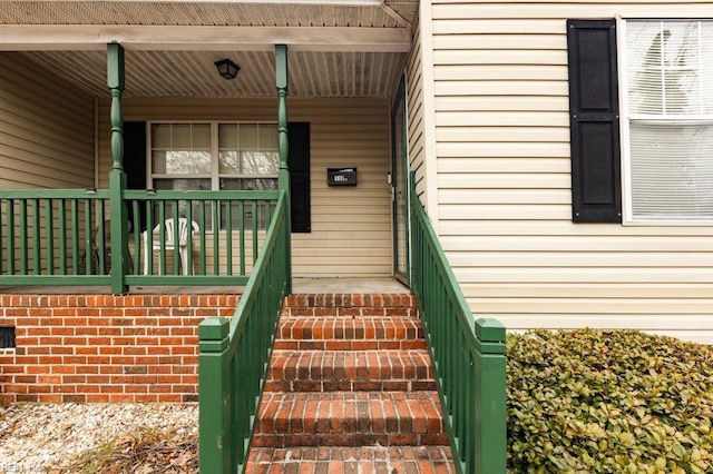 doorway to property with a porch