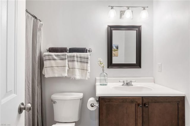 full bathroom featuring vanity and toilet