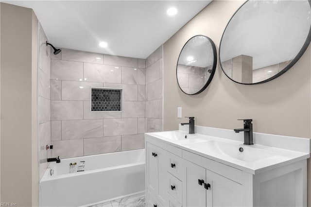 bathroom with  shower combination, double vanity, marble finish floor, and a sink