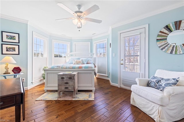 bedroom with multiple windows, crown molding, and wood-type flooring