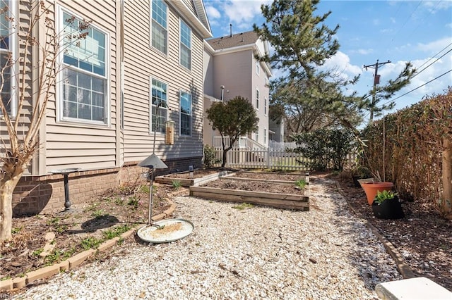 view of yard featuring a garden and fence