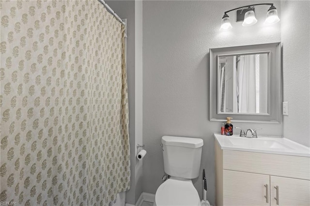 full bath with a shower with shower curtain, toilet, and vanity