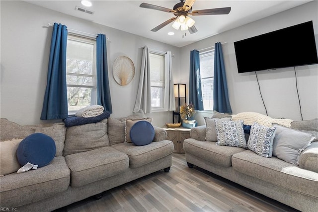 living area featuring recessed lighting, visible vents, wood finished floors, and a ceiling fan