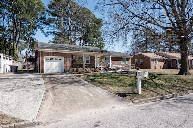 ranch-style home with a front yard, driveway, an attached garage, covered porch, and brick siding