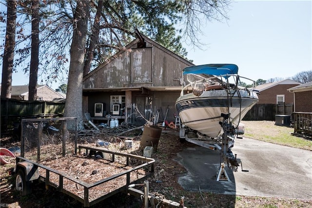 back of property featuring a fenced backyard