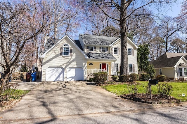 view of front facade featuring covered porch, driveway, an attached garage, and a front lawn