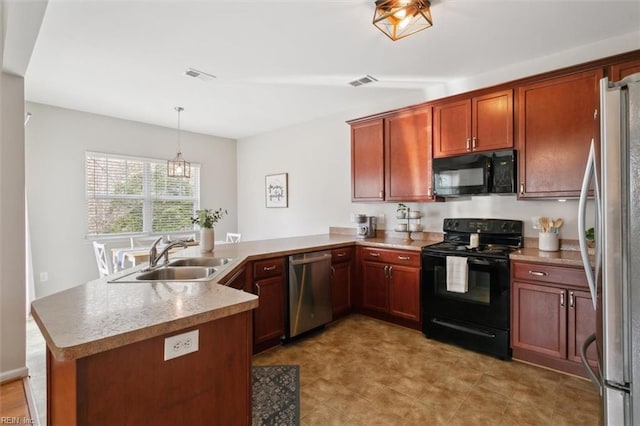 kitchen with black appliances, a peninsula, visible vents, and a sink