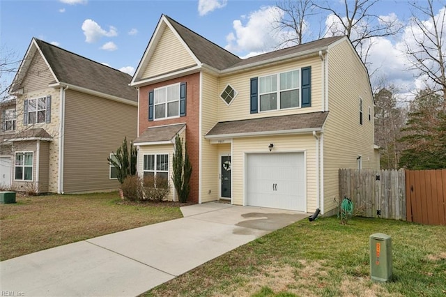 traditional-style house featuring a front yard, concrete driveway, an attached garage, and fence