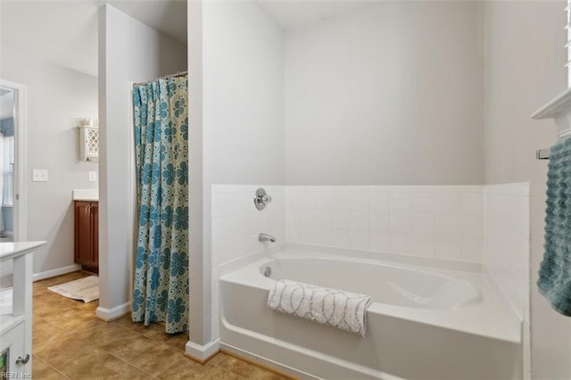 full bath with curtained shower, tile patterned flooring, baseboards, a bath, and vanity