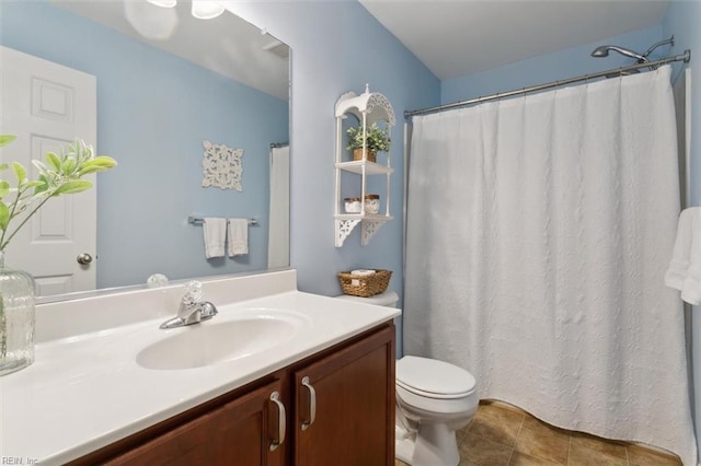 full bath with tile patterned floors, toilet, and vanity