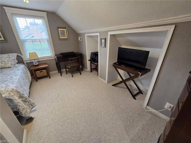 bedroom featuring baseboards, carpet floors, and lofted ceiling