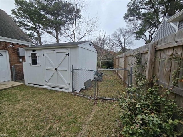 view of shed featuring fence