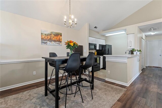 3853 Lasalle Dr Unit 110, Virginia Beach, VA 23453 - dining space with dark wood-style floors, visible vents, baseboards, an inviting chandelier, and lofted ceiling