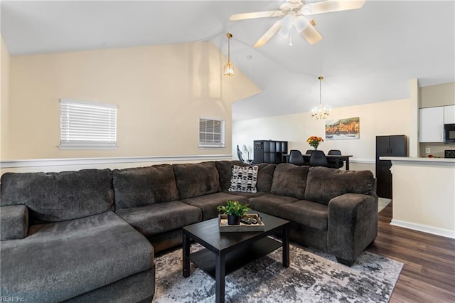 3853 Lasalle Dr Unit 110, Virginia Beach, VA 23453 - living room featuring ceiling fan with notable chandelier, vaulted ceiling, and wood finished floors