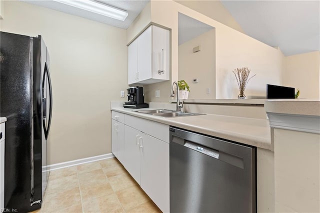 3853 Lasalle Dr Unit 110, Virginia Beach, VA 23453 - kitchen with a sink, stainless steel dishwasher, freestanding refrigerator, white cabinets, and light countertops