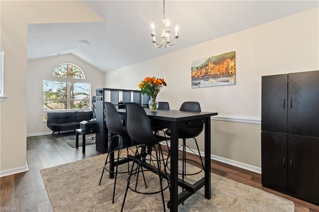 3853 Lasalle Dr Unit 110, Virginia Beach, VA 23453 - dining room featuring a chandelier, baseboards, lofted ceiling, and wood finished floors