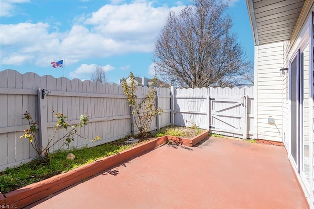 view of patio / terrace featuring a fenced backyard and a gate