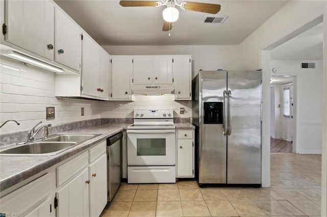 kitchen featuring under cabinet range hood, visible vents, appliances with stainless steel finishes, and a sink