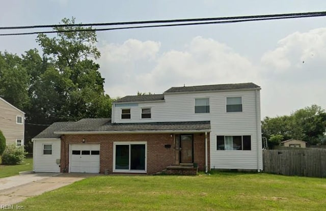 traditional-style home with a front lawn, an attached garage, fence, and driveway