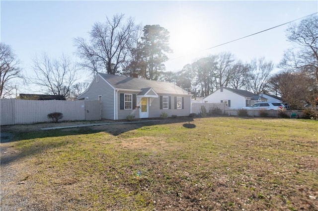 view of front facade with fence private yard and a front yard