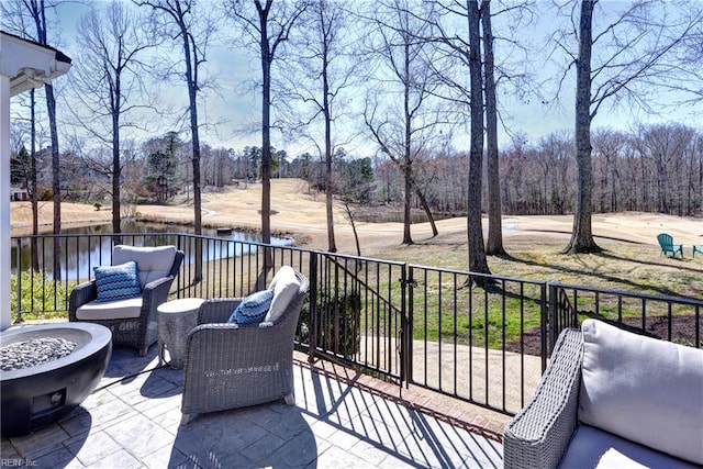 view of patio / terrace featuring a fire pit and a water view