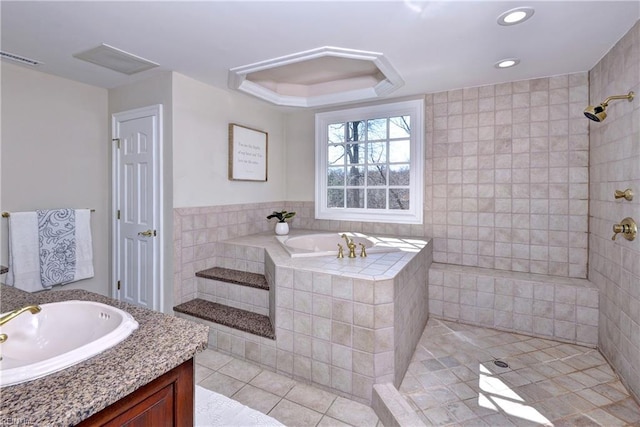 bathroom featuring tile patterned floors, visible vents, a garden tub, a tile shower, and vanity