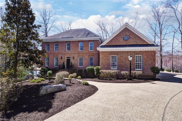 view of front of property featuring brick siding