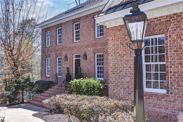 view of home's exterior featuring brick siding