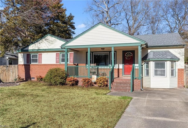 bungalow featuring crawl space, brick siding, covered porch, and a front yard