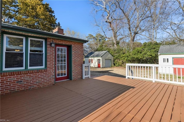 deck with an outbuilding and a shed