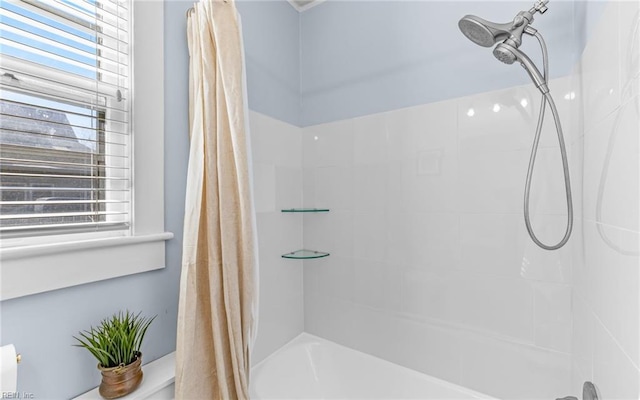 full bath featuring shower / bath combo with shower curtain