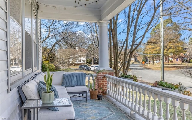 balcony featuring covered porch