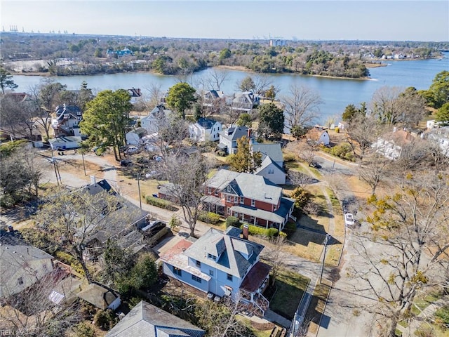 birds eye view of property with a water view and a residential view