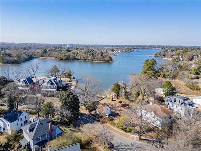 drone / aerial view with a residential view and a water view