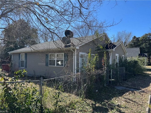 view of property exterior featuring fence