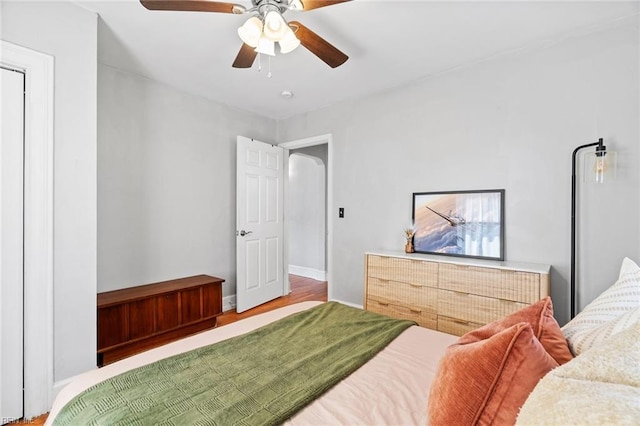 bedroom with baseboards and ceiling fan