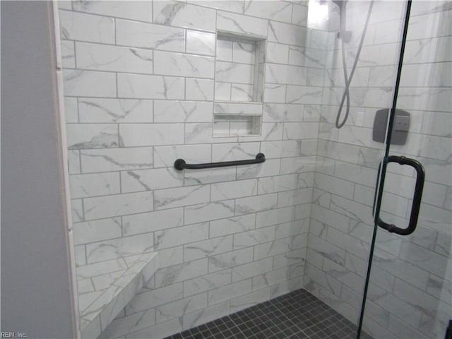 full bathroom featuring a shower stall