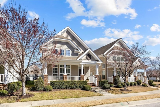 view of front of property with a porch and brick siding