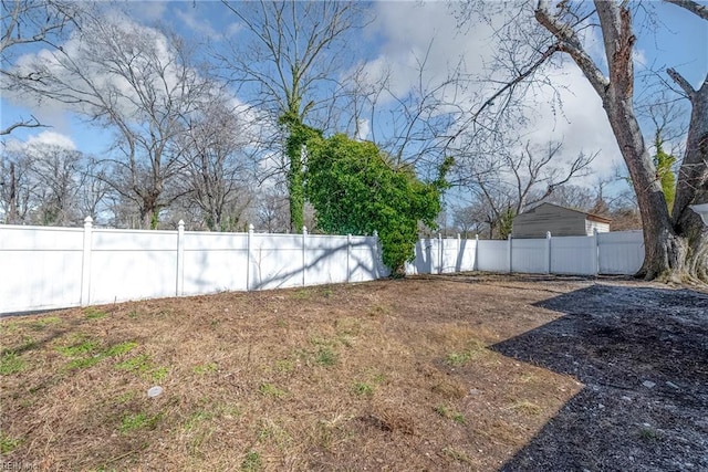 view of yard with a fenced backyard