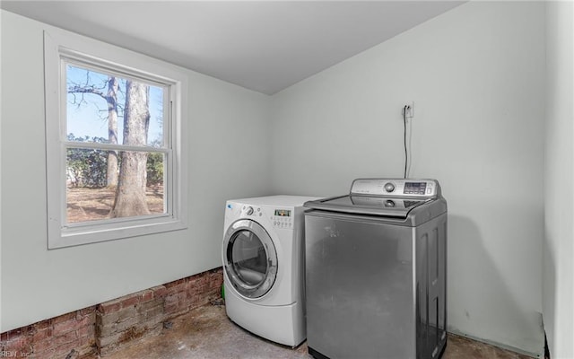 laundry room with separate washer and dryer and laundry area