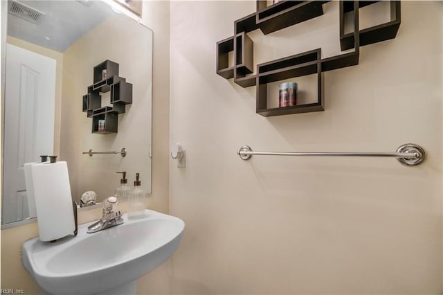 bathroom featuring a sink and visible vents