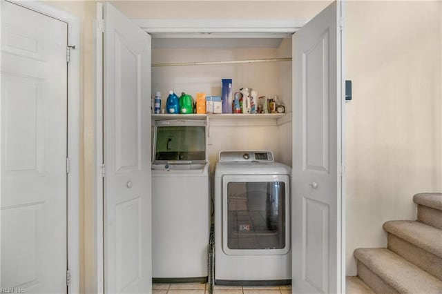 laundry area featuring washer and clothes dryer and laundry area