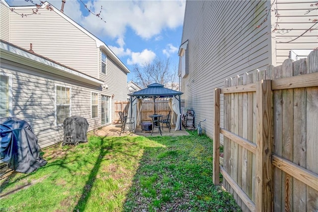 view of yard with a gazebo, a fenced backyard, and a patio