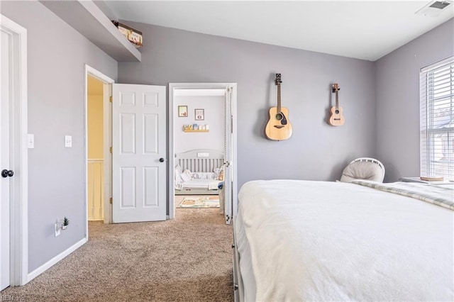 bedroom with carpet flooring, baseboards, and visible vents