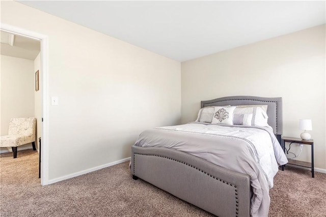 bedroom with baseboards and carpet flooring