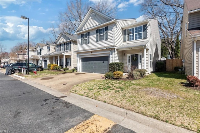 view of front of property with a front yard, fence, an attached garage, concrete driveway, and a residential view