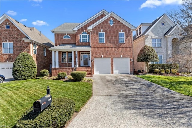 view of front of house with a garage, brick siding, concrete driveway, and a front yard