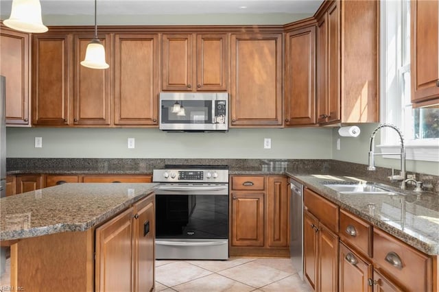 kitchen featuring brown cabinets and appliances with stainless steel finishes